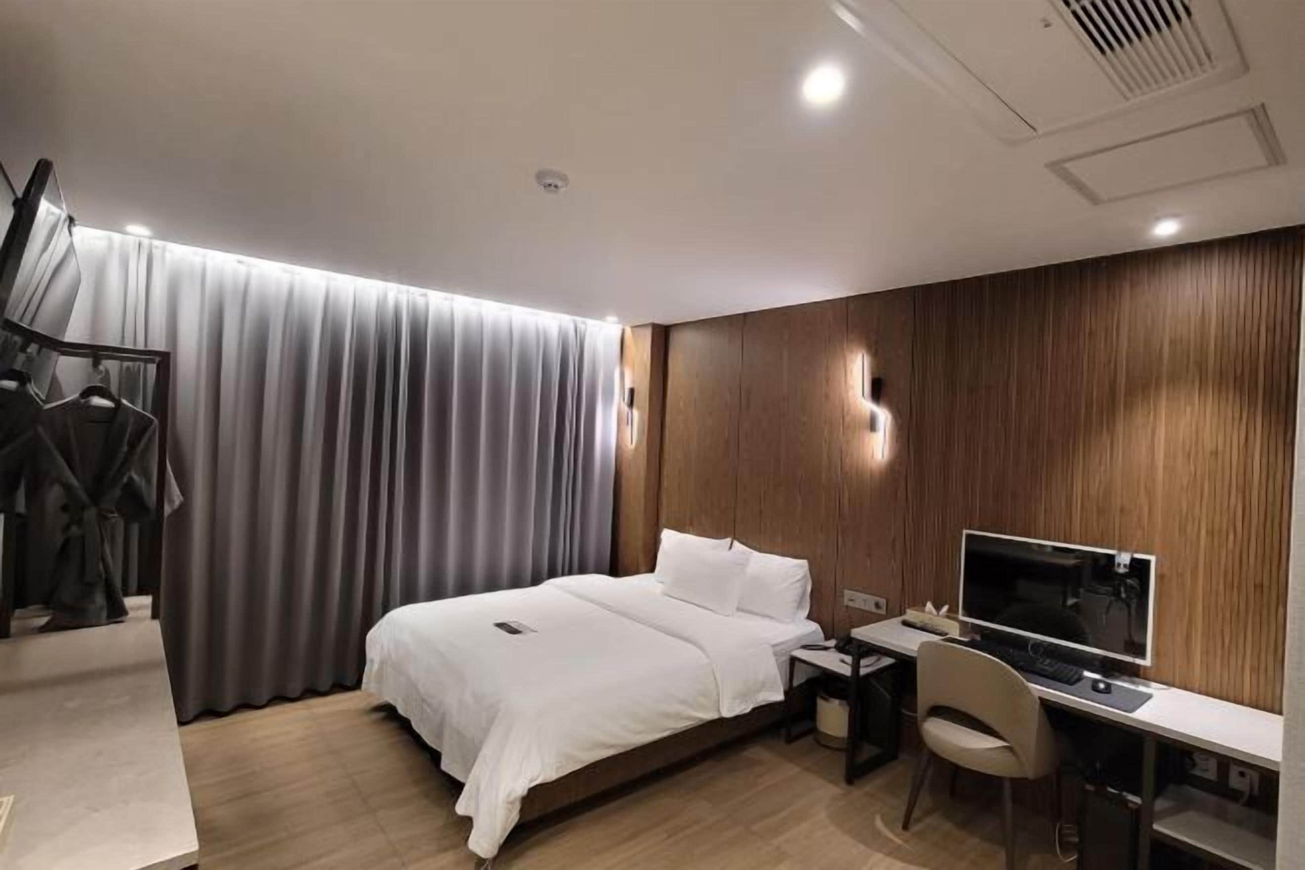 Desk, laptop workspace, blackout drapes, soundproofing