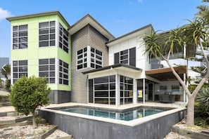 A striking contemporary home with a private pool, floor-to-ceiling windows, and serious street presence — welcome to your holiday base. - Sandy View - 180 degree views - Luxury Home (Nikenbah)