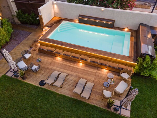 Outdoor pool, open 10:30 AM to 7:30 PM, pool umbrellas, pool loungers