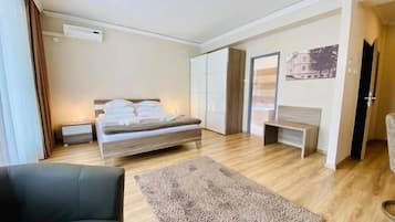 Premium room first floor | Minibar, in-room safe, desk, iron/ironing board