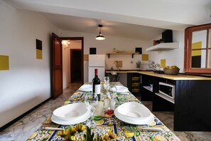 Enjoy meals in style with a beautifully set table and a fully equipped kitchen.