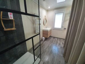 Shower, hair dryer, towels, soap