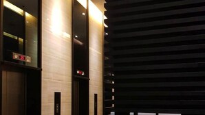 A modern elevator area with a 'LIFT' sign, indicating an elevator service point. - One Bedroom Balcony With Great Location and Value (Makati)