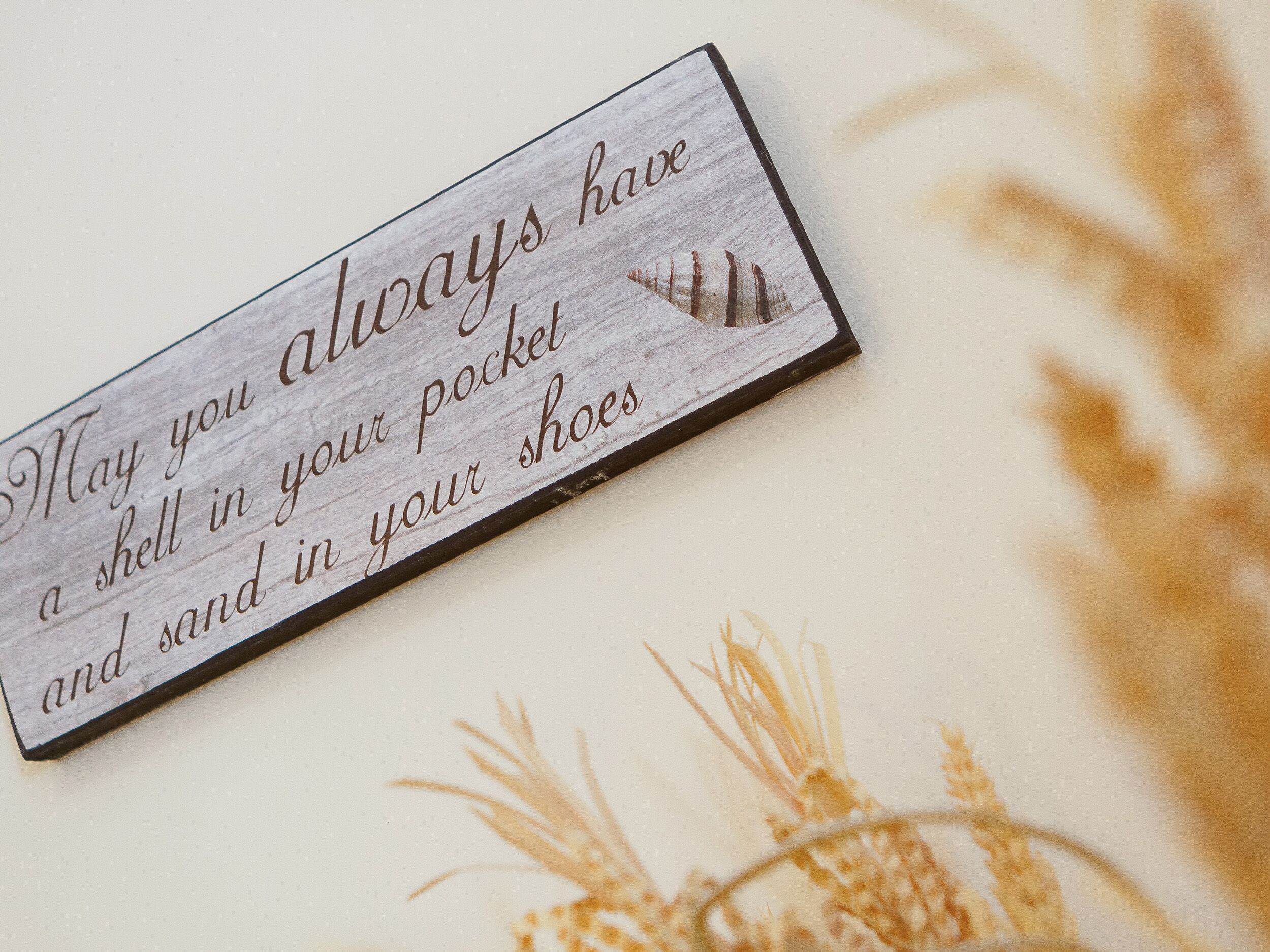 A wooden sign with a message.