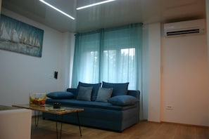 Apartment, 1 Queen-Bett und Schlafsofa | Wohnzimmer