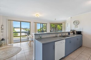 Enjoy meals in the kitchen with a central island and dishwasher, offering views of the surrounding area.