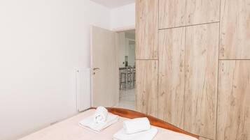 2 bedrooms, blackout curtains, soundproofing, iron/ironing board