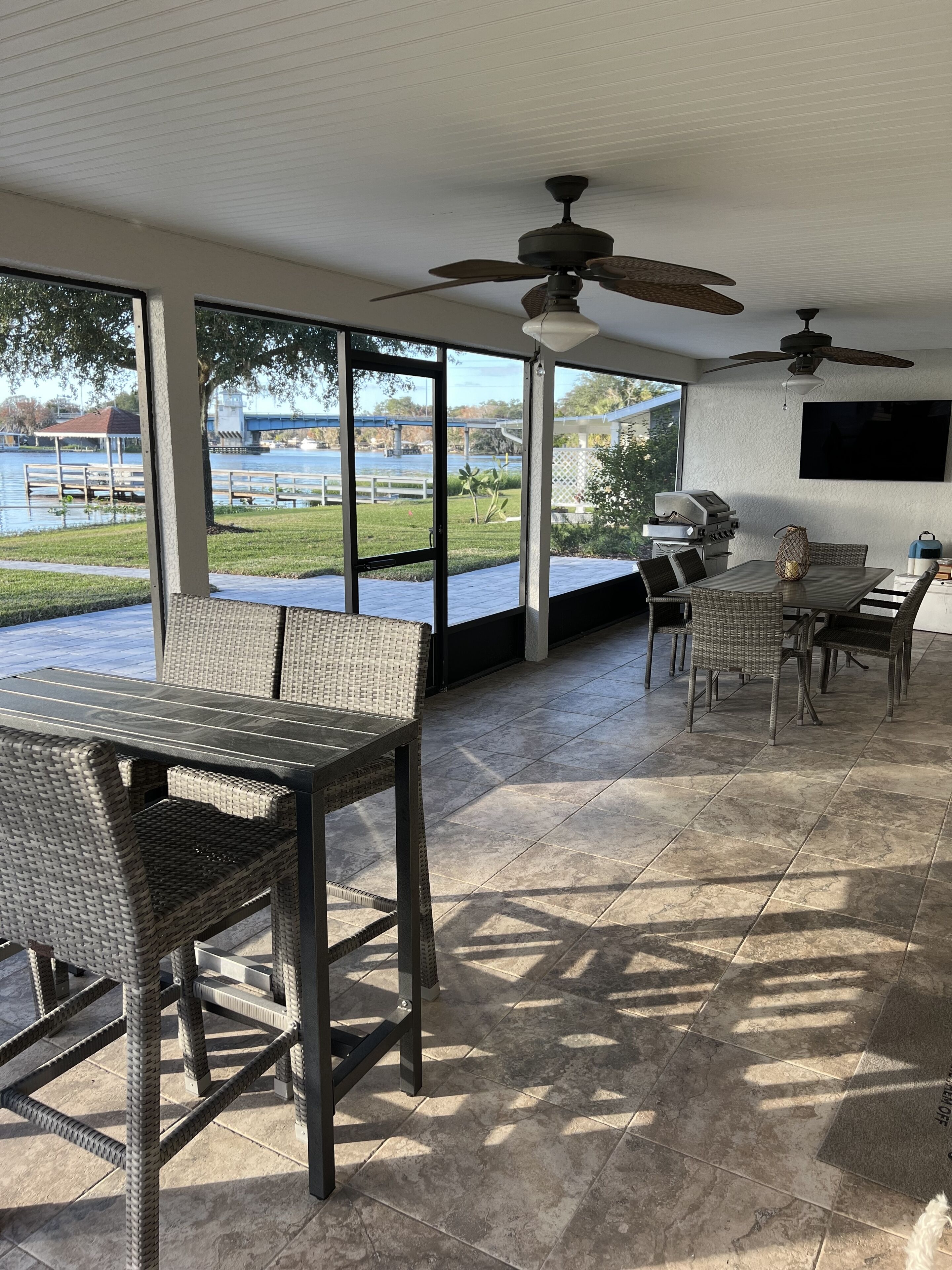 Screened in porch with grill and tv
