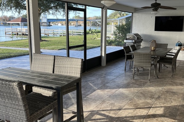 Screened in porch with grill and tv