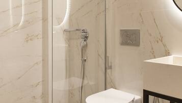 A modern bathroom with a glass-enclosed shower, a white toilet, and a wooden floor.
