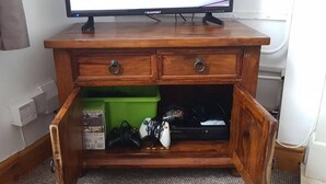 A wooden cabinet with two drawers and a green storage box underneath. - Kettering Town Corporate - Ford Street (Kettering)