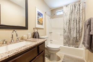 Bathtub, hair dryer, towels, soap