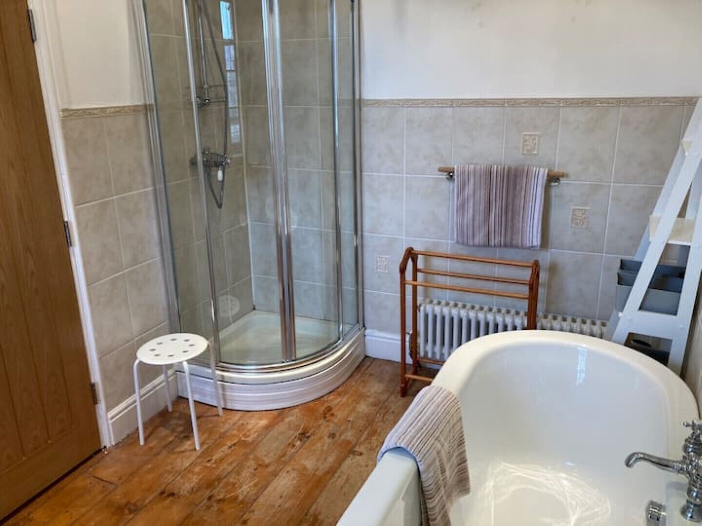 Bathtub, hair dryer, towels, soap