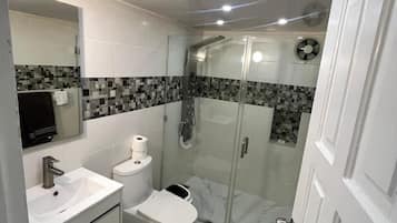 Shower, towels, soap, toilet paper