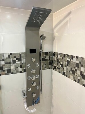 Shower, towels, soap, toilet paper