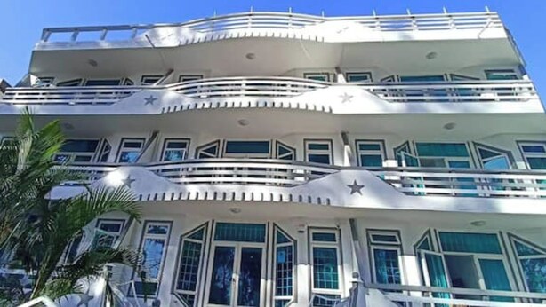 A multi-story building with balconies, large windows, and a modern architectural design. - Apartment 1 Chambre Avec Balcon Face à la Plage (Flic en Flac)