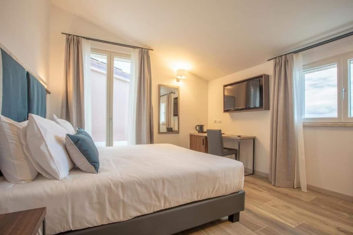 Premium bedding, down comforters, desk, laptop workspace