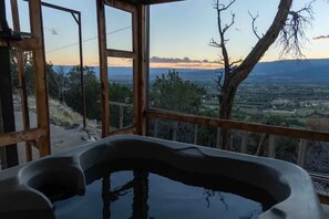 A hot tub with a view of a mountainous landscape. - The Roost: Mesa-Edge Valley Views, Hot Tub & Fenced Dog Orchard near Grand Mesa (Cedaredge)
