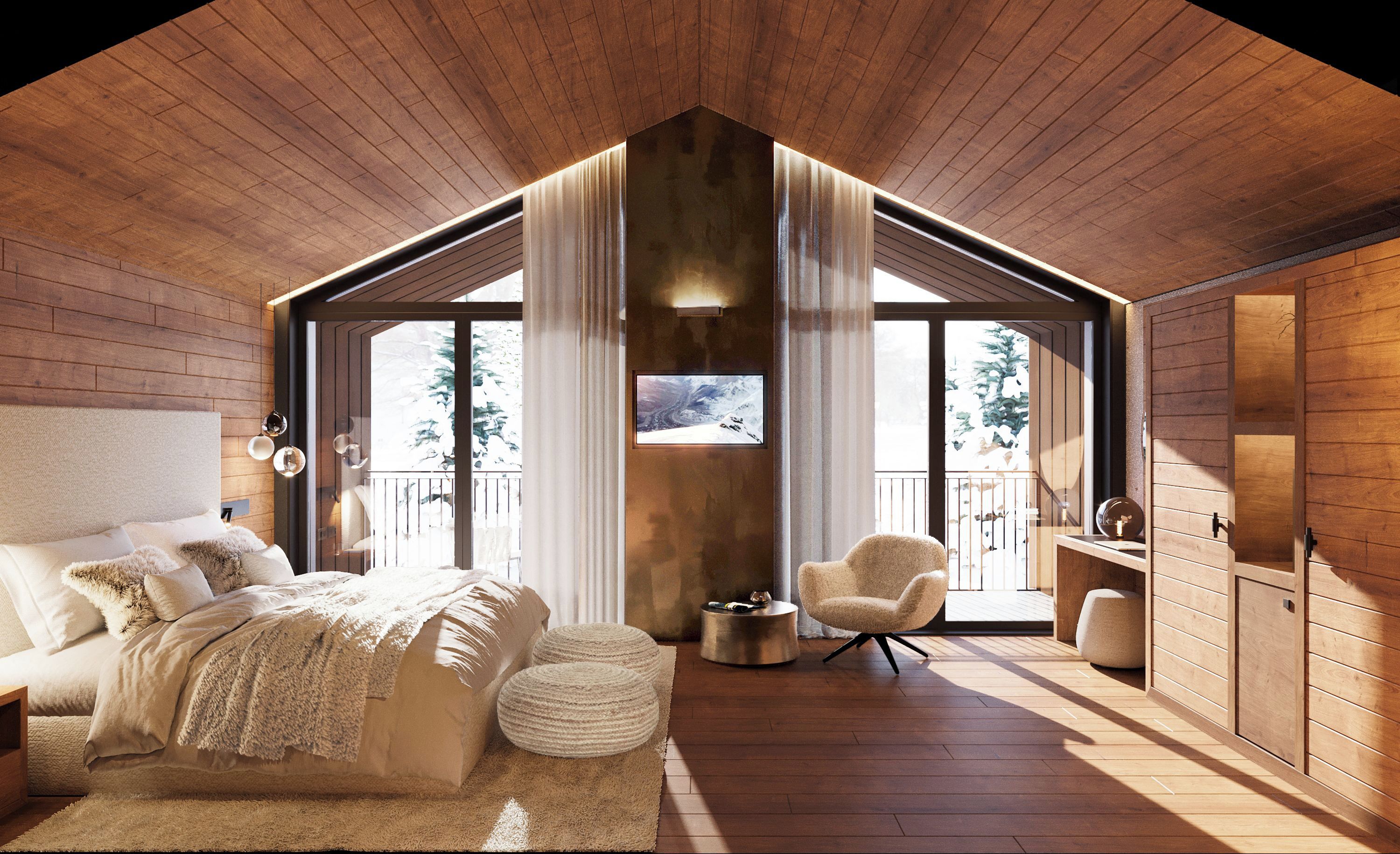 Een slaapkamer met een groot bed, een stoel en een klein tafeltje. Er is een balkon met uitzicht op bomen.