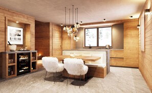 Una cocina moderna con armarios de madera, un comedor con un banco acolchado blanco y un amplio ventanal con vistas.