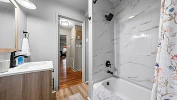 Combined shower/tub, hair dryer, towels, soap