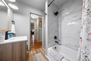 Combined shower/tub, hair dryer, towels, soap