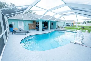 Outdoor pool, a heated pool - Heated Salt Water Pool Home- Sleeps 12- Putting Green (Port St. Lucie)