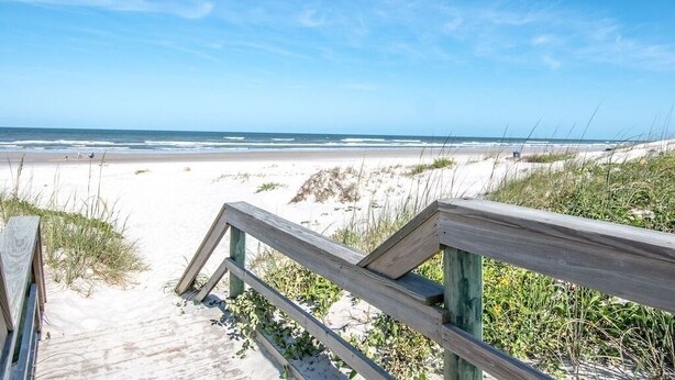 A wooden boardwalk leading to a beach with clear skies. - NEW LISTING!Stunning Sea Place Renovated -Oceanview 1st floor 2bd/bath (St. Augustine)