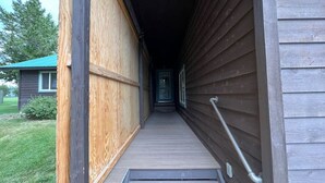 A wooden building with a ramp leading to a door. - Golf Course, Close to YNP, Groceries, Restaurants (Island Park)