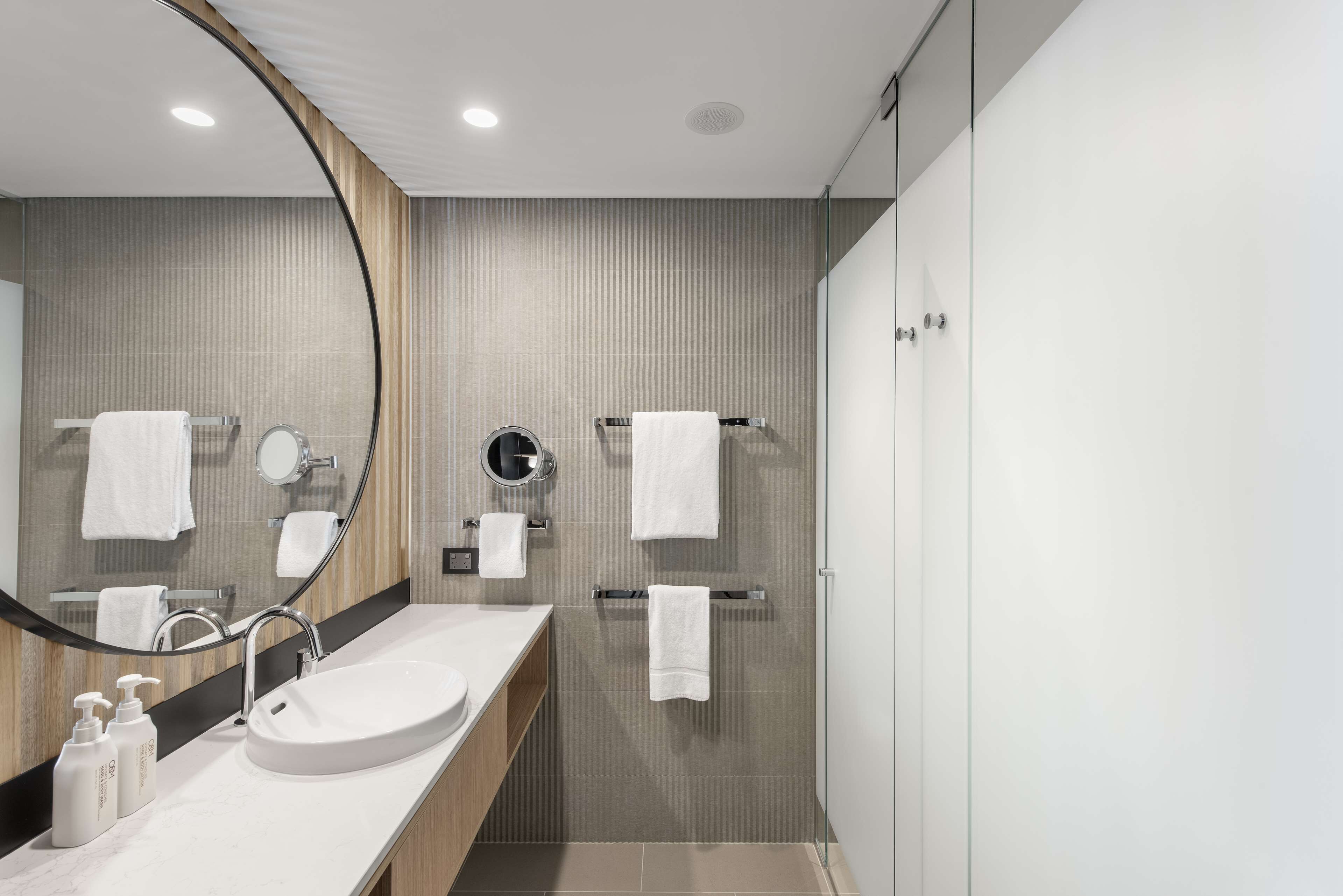Designer toiletries, hair dryer, towels, soap