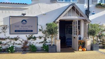 Enjoy a welcoming entrance with a pitched roof and access to a bar, restaurant, and room facilities.
