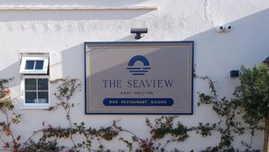A sign for "The Seaview" bar, restaurant, and rooms in East Preston.