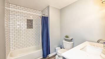 Combined shower/tub, hair dryer, towels, soap