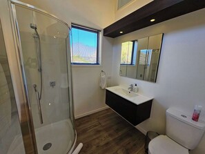 Bathtub, eco-friendly toiletries, hair dryer, towels