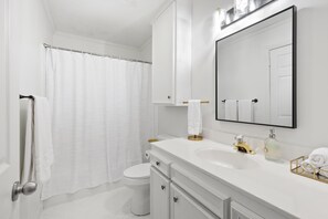 Combined shower/tub, hair dryer, towels, soap