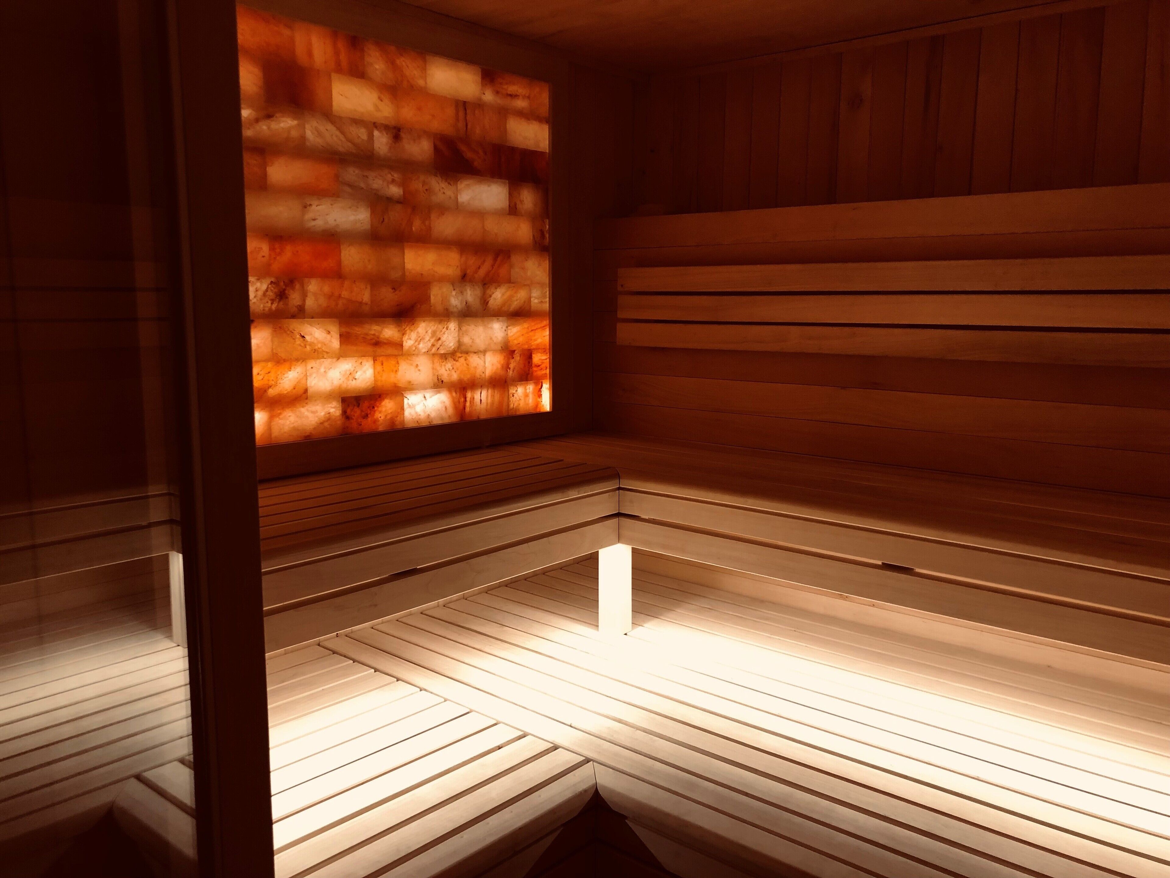 A sauna with wooden walls and benches.