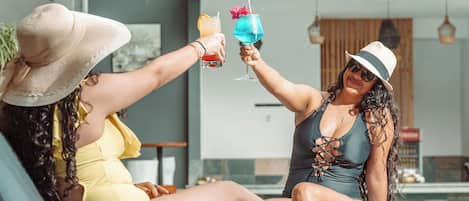 Outdoor pool, open 7:00 AM to 10:00 PM, sun loungers