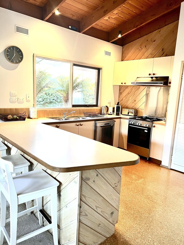 Fridge, microwave, oven, stovetop - Spacious beach home with big back garden (Rosebud)