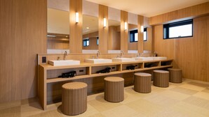 A modern bathroom with three sinks, large mirrors, and wicker stools. - HOTEL SHURANZA MAKUHARI BAY (Chiba)