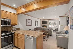 Condo (Alpenblick 9) | Private kitchen | Fridge, coffee/tea maker, dining tables