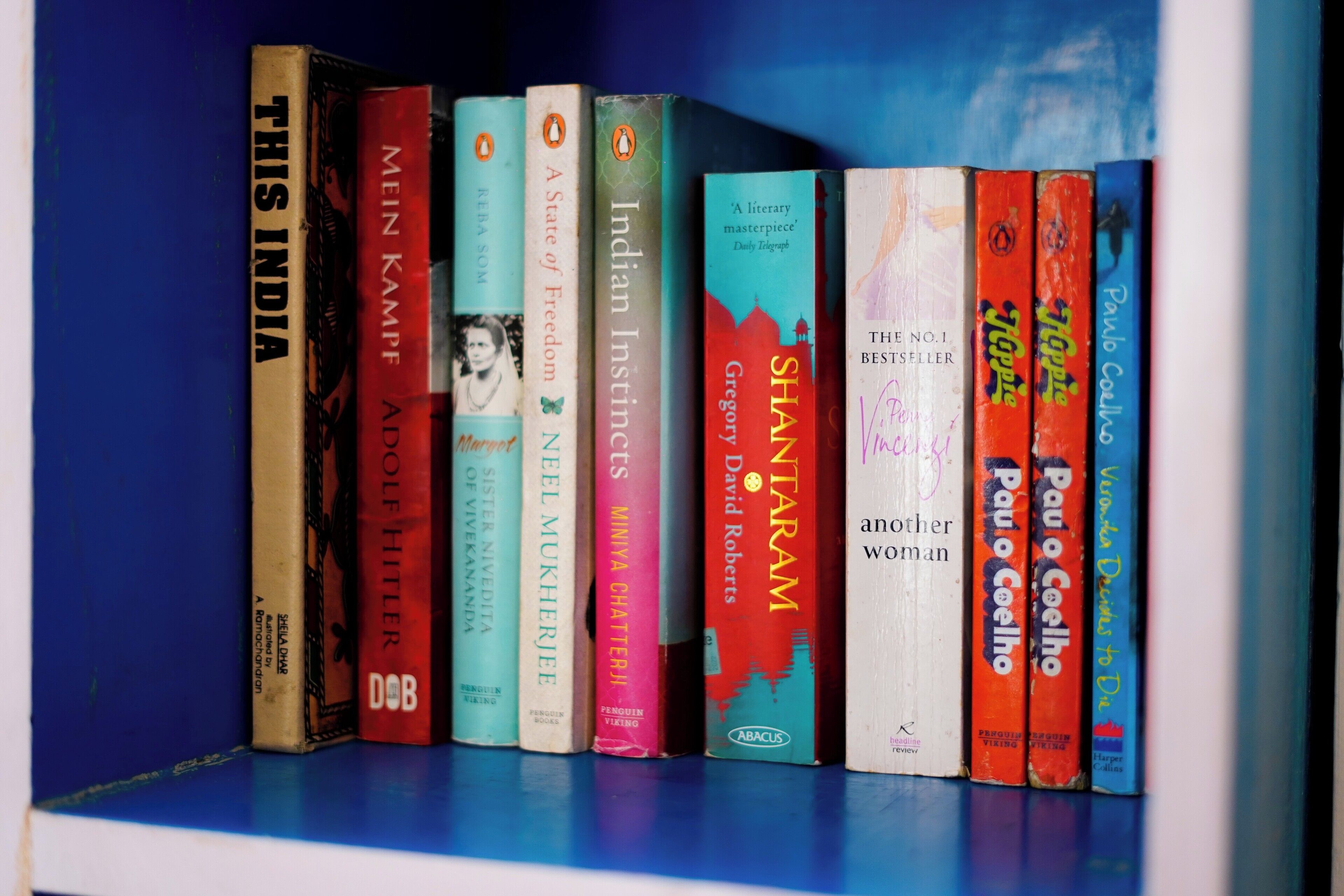 A bookshelf with various books.