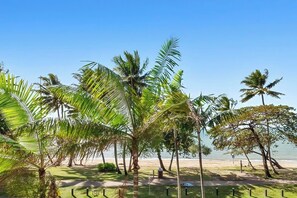 Enjoy a serene beachfront setting with clear pathways for walking and access to the ocean.