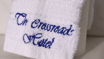 A white towel with embroidered text.