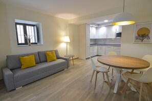 Family Apartment | Living area | 45-inch Smart TV with satellite channels, TV