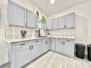 Fridge, microwave, stovetop, coffee/tea maker