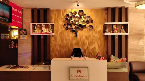 A reception desk with a sign reading "Sri Maharaja Residency." - Sri Maharaja Residency (Tiruchirappalli)