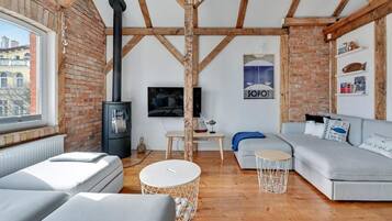 Premium Apartment, 1 Bedroom, Mezzanine | Living room | 42-inch flat-screen TV with cable channels, TV