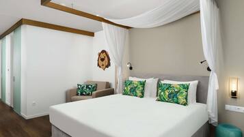 A modern bedroom with a large bed, a chair, a wall-mounted lion head decoration, and a nightstand with a lamp.