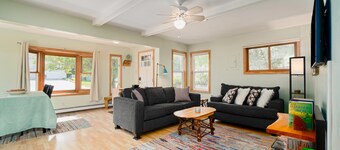 Dog-friendly cottage with fenced yard, firepit, W/D, & WiFi - walkable location