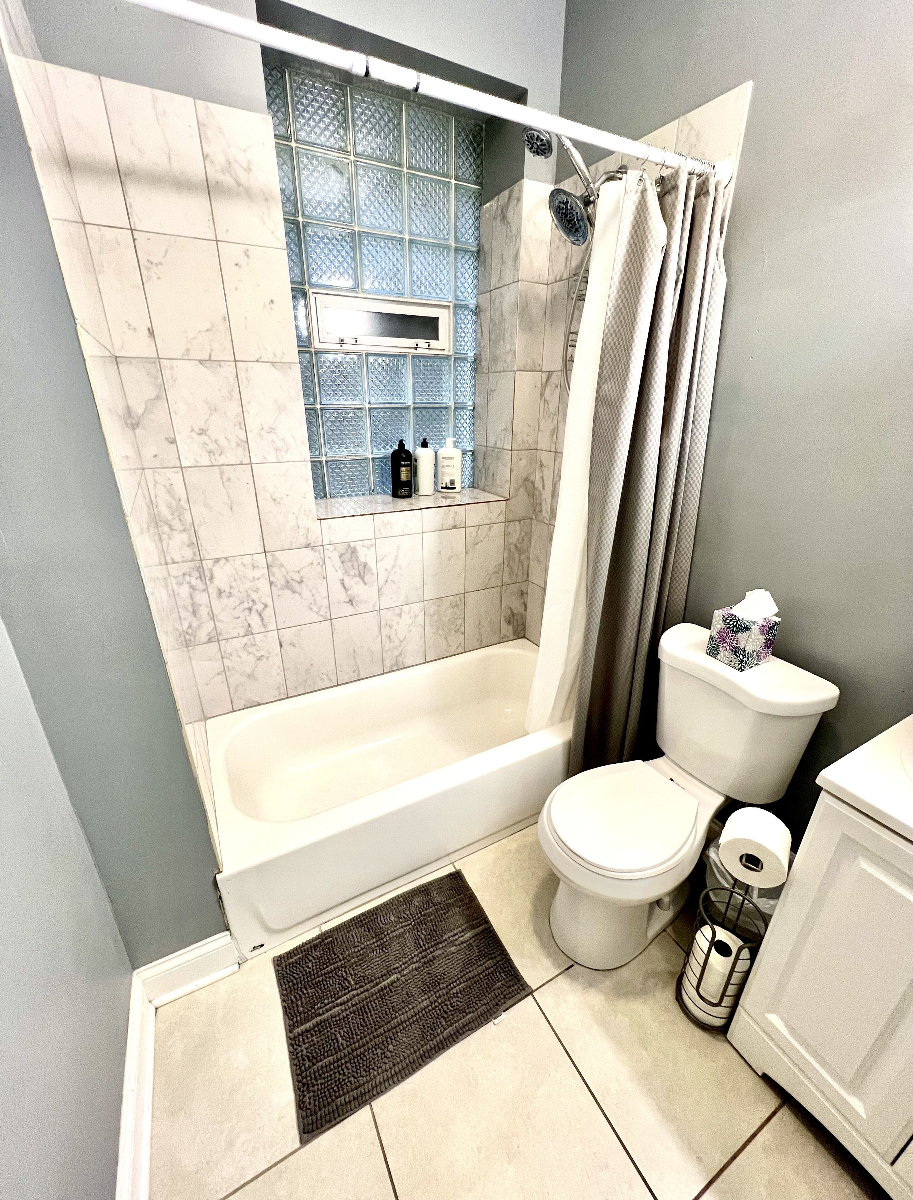 Combined shower/tub, hair dryer, towels, soap